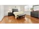 The main bedroom boasts wood floors, a large window, and matching furniture at 6175 Sw 88Th Loop, Ocala, FL 34476