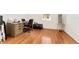 Office area with wood floors, a desk setup, and natural light, offering a functional workspace at 6175 Sw 88Th Loop, Ocala, FL 34476