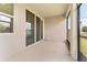 Enclosed patio with a view of the backyard and sliding glass door at 6175 Sw 88Th Loop, Ocala, FL 34476