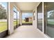 Enclosed patio with a view of the backyard at 6175 Sw 88Th Loop, Ocala, FL 34476