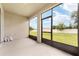 Enclosed patio with a view of the backyard at 6175 Sw 88Th Loop, Ocala, FL 34476