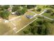Large fenced property featuring a house, shed in the back and lawn at 6250 Se 88Th St, Ocala, FL 34472