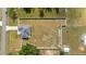 An aerial view shows the home and a large, fenced backyard perfect for outdoor activities and privacy at 6250 Se 88Th St, Ocala, FL 34472
