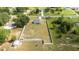 Aerial view of fenced-in property with shed and lawn at 6250 Se 88Th St, Ocala, FL 34472