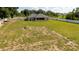 An aerial view shows the home's expansive, fenced backyard, perfect for a variety of activities at 6250 Se 88Th St, Ocala, FL 34472