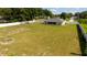 A wide aerial view shows the home's screened in porch and expansive, fenced backyard at 6250 Se 88Th St, Ocala, FL 34472