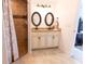 Tiled bathroom with double sinks and a walk-in shower, perfect for everyday living at 6250 Se 88Th St, Ocala, FL 34472