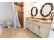 Bathroom featuring double sinks, granite countertops, a tiled shower, and tile flooring at 6250 Se 88Th St, Ocala, FL 34472