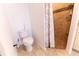 Well-lit bathroom featuring a toilet, walk-in shower, and tiled flooring at 6250 Se 88Th St, Ocala, FL 34472