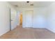Cozy bedroom with carpet and a closet, offering a calming space near the bathroom at 6250 Se 88Th St, Ocala, FL 34472