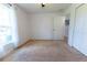Bright bedroom with a window, neutral carpet, and nearby access to another room at 6250 Se 88Th St, Ocala, FL 34472