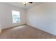Bedroom with neutral carpet, natural light, and a relaxing ambiance at 6250 Se 88Th St, Ocala, FL 34472