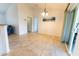 Dining room with a tile floor adjacent to the kitchen with sliding glass doors to the outside at 6250 Se 88Th St, Ocala, FL 34472