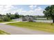 Charming single-story home featuring a two-car garage, well-maintained lawn, and surrounded by a secure white fence at 6250 Se 88Th St, Ocala, FL 34472