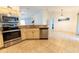 Well-lit kitchen featuring stainless steel appliances, tile floors, and ample counter space at 6250 Se 88Th St, Ocala, FL 34472