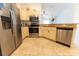 Spacious kitchen with stainless steel appliances, tile floors and a breakfast bar at 6250 Se 88Th St, Ocala, FL 34472