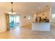 Inviting eat-in kitchen features stainless steel appliances, bar seating, and sliding glass door to patio at 6250 Se 88Th St, Ocala, FL 34472