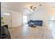 Spacious living room filled with light, featuring neutral paint and ceiling fan at 6250 Se 88Th St, Ocala, FL 34472