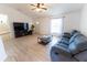 Comfortable living room with vaulted ceilings, lots of light, and a ceiling fan at 6250 Se 88Th St, Ocala, FL 34472