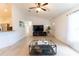Bright living room boasts vaulted ceilings, light floors, and seamlessly connects to the kitchen at 6250 Se 88Th St, Ocala, FL 34472