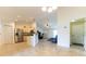 Spacious living area showcasing tile floors, access to kitchen, living room and laundry room at 6250 Se 88Th St, Ocala, FL 34472
