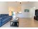 Bright living room boasts vaulted ceilings, light floors, and seamlessly connects to the kitchen at 6250 Se 88Th St, Ocala, FL 34472