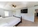 This spacious bedroom offers a ceiling fan, great natural light, and a wall-mounted television at 6250 Se 88Th St, Ocala, FL 34472