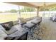 Relaxing screened patio with comfortable seating, perfect for enjoying the outdoors at 6250 Se 88Th St, Ocala, FL 34472