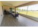 Spacious screened-in patio with tile flooring and comfortable seating, ideal for outdoor living at 6250 Se 88Th St, Ocala, FL 34472