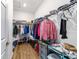 Walk-in closet with ample shelving and hanging space, providing excellent storage solutions at 8905 Sw 76Th Ln, Ocala, FL 34481