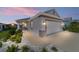Charming single-story home featuring a two-car garage, well-maintained landscaping, and neutral color palette at 8905 Sw 76Th Ln, Ocala, FL 34481