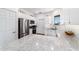 Modern eat-in kitchen with stainless-steel appliances and gorgeous counters and cabinetry at 8905 Sw 76Th Ln, Ocala, FL 34481