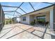 Large screened lanai with brick pavers, seamlessly connected to the home and backyard, perfect for outdoor living and entertaining at 8905 Sw 76Th Ln, Ocala, FL 34481