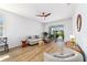 Cozy living room with ceiling fan and sliding glass doors to the lanai at 8905 Sw 76Th Ln, Ocala, FL 34481