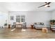 Well-lit living room featuring modern furniture and wood flooring at 8905 Sw 76Th Ln, Ocala, FL 34481