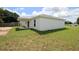 This is a back view of the house featuring a covered patio at 9 Hemlock Terrace Ln, Ocala, FL 34472