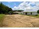 A rear view of the property highlighting the ample outdoor space and neat boundary fencing at 9 Hemlock Terrace Ln, Ocala, FL 34472
