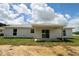 Home with patio and sliding glass doors overlooking a well-maintained backyard at 9 Hemlock Terrace Ln, Ocala, FL 34472
