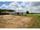 This is an image of the backyard space with a view of the home's back facade at 9 Hemlock Terrace Ln, Ocala, FL 34472