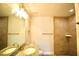 This bathroom includes a granite countertop sink and a tiled walk-in shower at 9 Hemlock Terrace Ln, Ocala, FL 34472