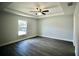 Bedroom features a ceiling fan and a window to let natural light inside the home at 9 Hemlock Terrace Ln, Ocala, FL 34472