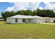 Charming single-story home features a light-colored exterior, attached garage, and a neatly maintained lawn at 9 Hemlock Terrace Ln, Ocala, FL 34472