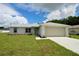 Charming single-story home with a well-manicured lawn and attached two car garage at 9 Hemlock Terrace Ln, Ocala, FL 34472