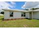Well-maintained one story home with green lawn, manicured flowerbeds and front entry at 9 Hemlock Terrace Ln, Ocala, FL 34472