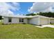 Desirable one story home featuring an attached two-car garage and a lush lawn at 9 Hemlock Terrace Ln, Ocala, FL 34472