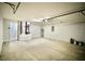 Large garage featuring a water heater, utility sink, and plenty of space for vehicles at 9 Hemlock Terrace Ln, Ocala, FL 34472