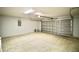 Spacious garage with an automatic door and ample room for parking and storage at 9 Hemlock Terrace Ln, Ocala, FL 34472