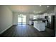 Modern kitchen with granite countertops, stainless steel appliances, and access to the backyard at 9 Hemlock Terrace Ln, Ocala, FL 34472