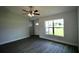 Bright living room featuring a ceiling fan, and a large window at 9 Hemlock Terrace Ln, Ocala, FL 34472