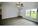 Inviting living room featuring neutral paint, durable floors, and a front door with a window at 9 Hemlock Terrace Ln, Ocala, FL 34472